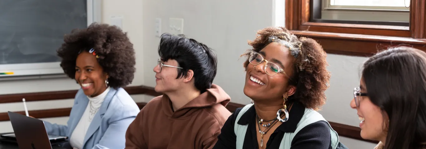 Washington University students at a table. 