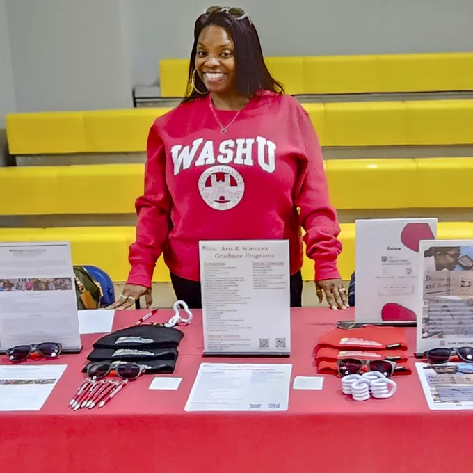 "WashU recruiter attending a conference event"